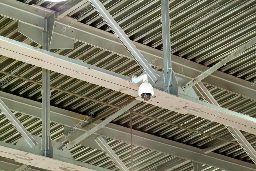 Construction team coordinating steelwork and security installation