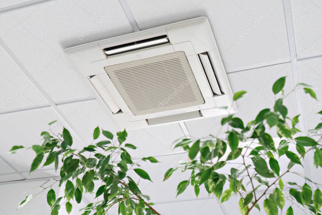 Ceiling cassette air conditioner in a modern office.