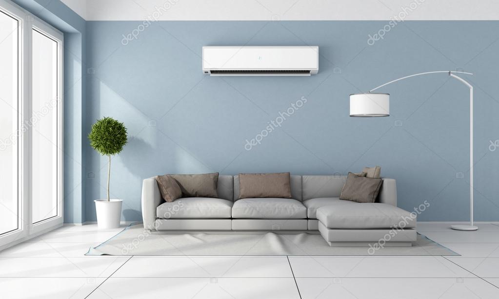 Living room with a discreet split air conditioner unit.